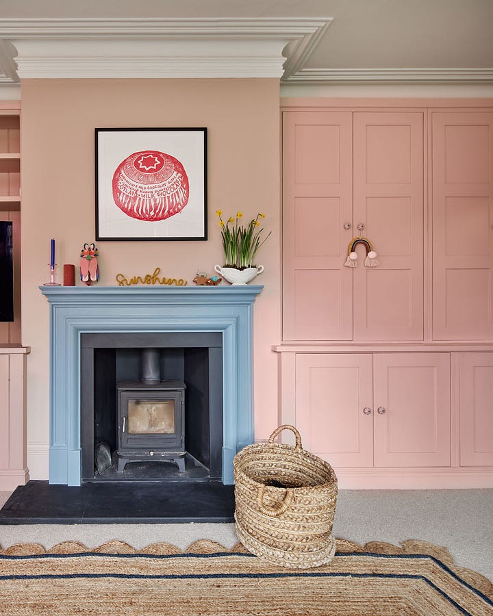 fireplace makeover before and after pink paint chimney breast storage built-in cupboards