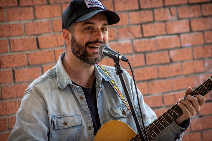 photos of Darion Ryan Roberts singing and playing guitar