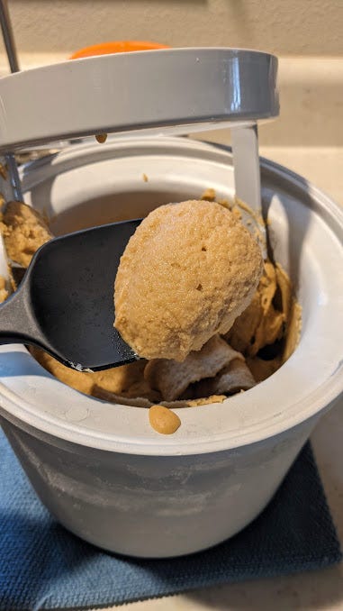 2 photos of ice cream in the maker: one of orange pumpkin spice and one of pale pancake flavor with bits of stroopwafel