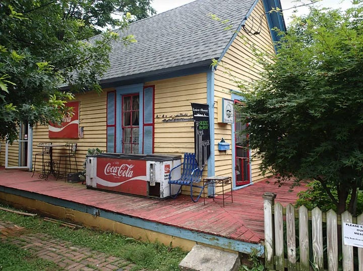 A house with fading paint on the left and, on the right, the same house, bright yellow, red patio, and blue and red trim after the volunteer crew did their work.