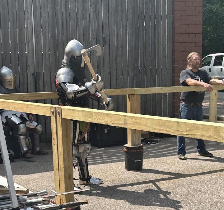 4 photos, first is author Naomi Novik on a zoom interview. Second is a person in medieval metal armor wielding an axe. Third is Marty next to a hand-made wooden wishing well. Fourth is a room of children and parents at craft time.