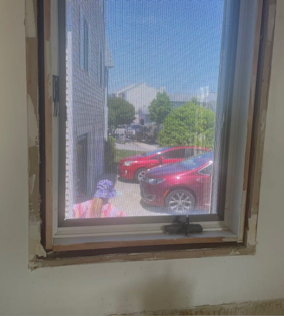 girl jumping on trampoline and a view of the street