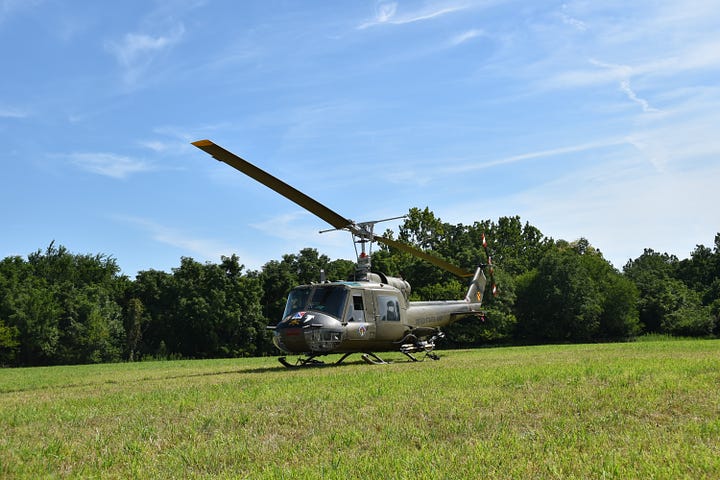 Scenes from American Huey 369 Patriot Day with pilots and volunteers.
