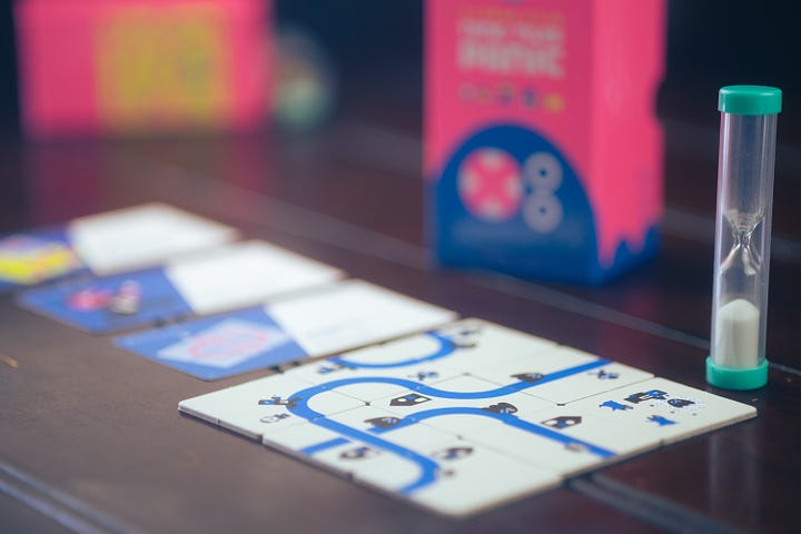 The games Nine Tiles Panic and Town 77, published by Oink Games.