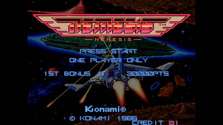 On the left, a screenshot of the Gradius title screen, which is a plain, black background with the winged Gradius logo at the top. Press Start, player number, extend info, and copyright fill the rest of the middle of the screen up. On the right, a screenshot of the title screen for the North American version of Gradius, titled Nemesis, which is the same as the Gradius screen, except the background isn't black: it shows the Vic Viper flying into the background, battling a giant ship. Moai heads shooting rings, planetary surfaces, and a star are also shown.