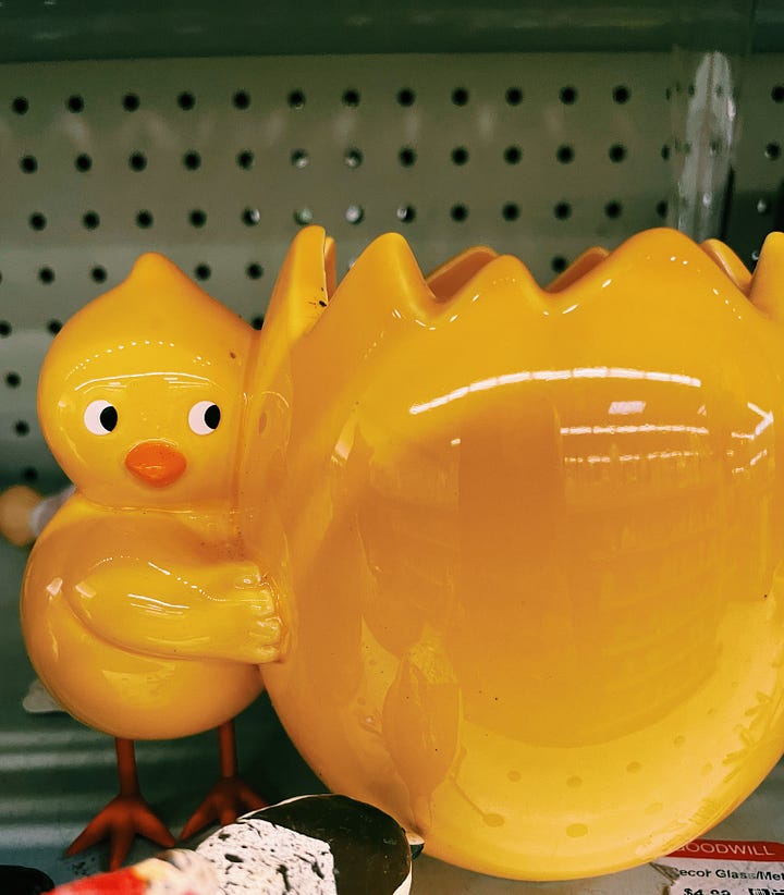 [yellow ceramic chick and oversized egg at Goodwill; selfie with peachie-pink reading glasses and gold under-eye mask]