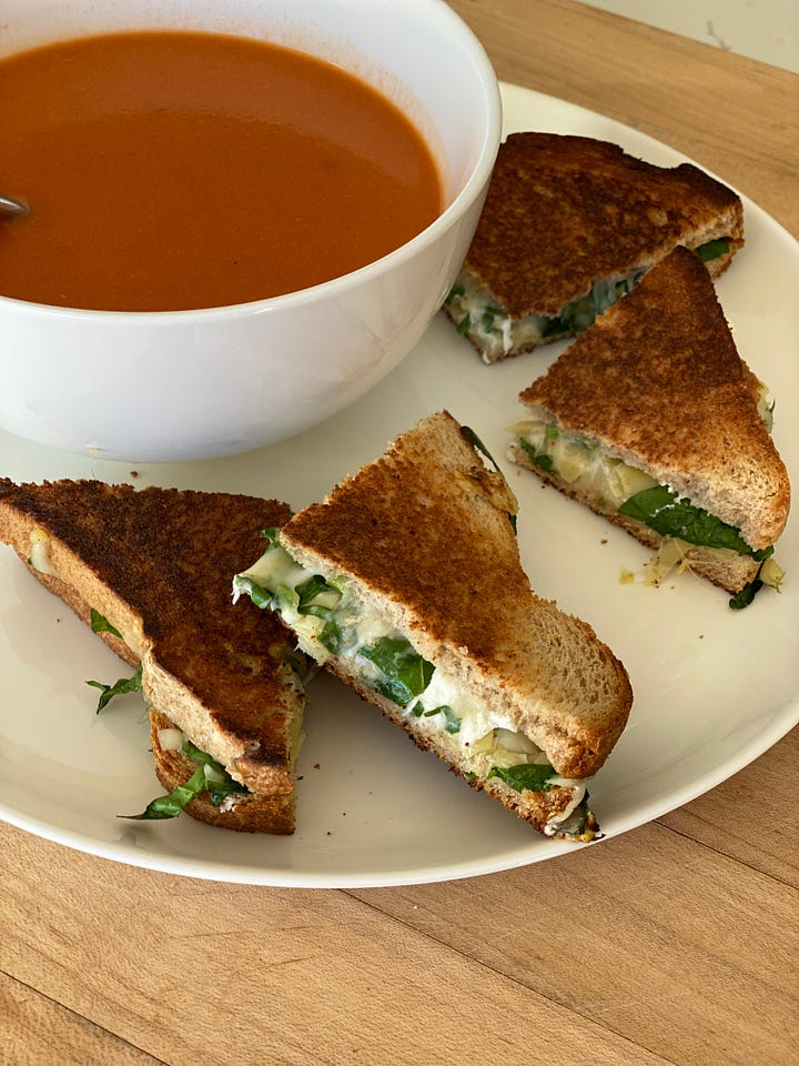 spinach and artichoke grilled cheese, in the pan and on the plate