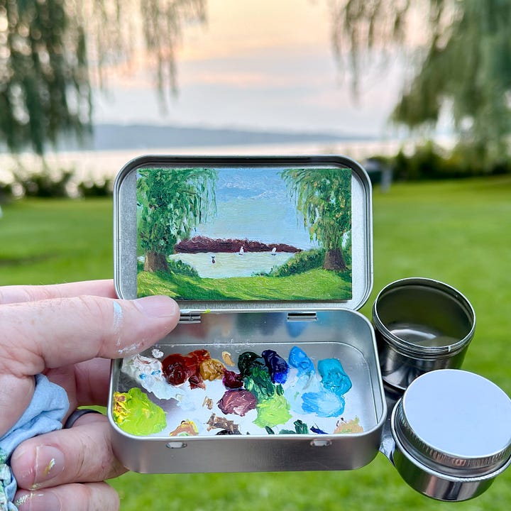 A series of mini paintings in metal mint tins.