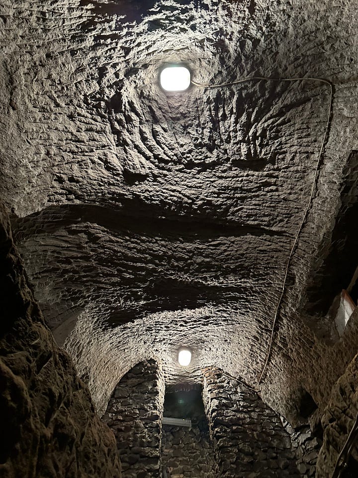 Two views of the catacomb of Saint Sophia. 1, looking up into the chamber from below. 2, looking back into the chamber after having climbed the stair into the space