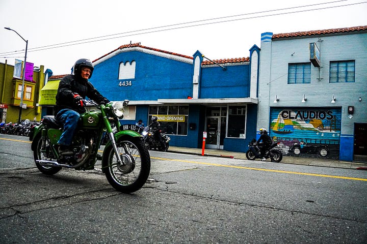 Rider on green classic motorcycle