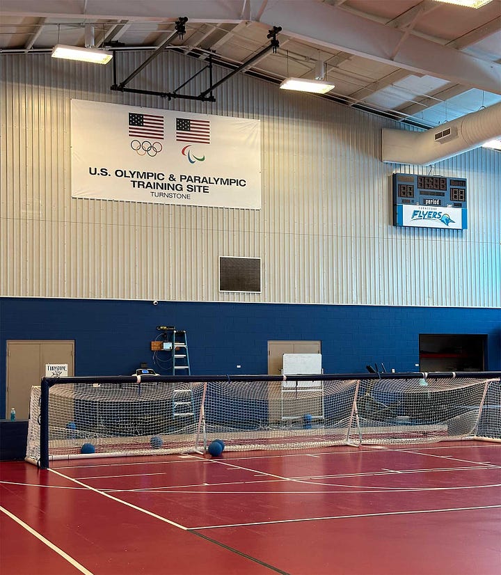 Goal ball court at Paralympic gym and selfie of John on a mini train at the zoo.