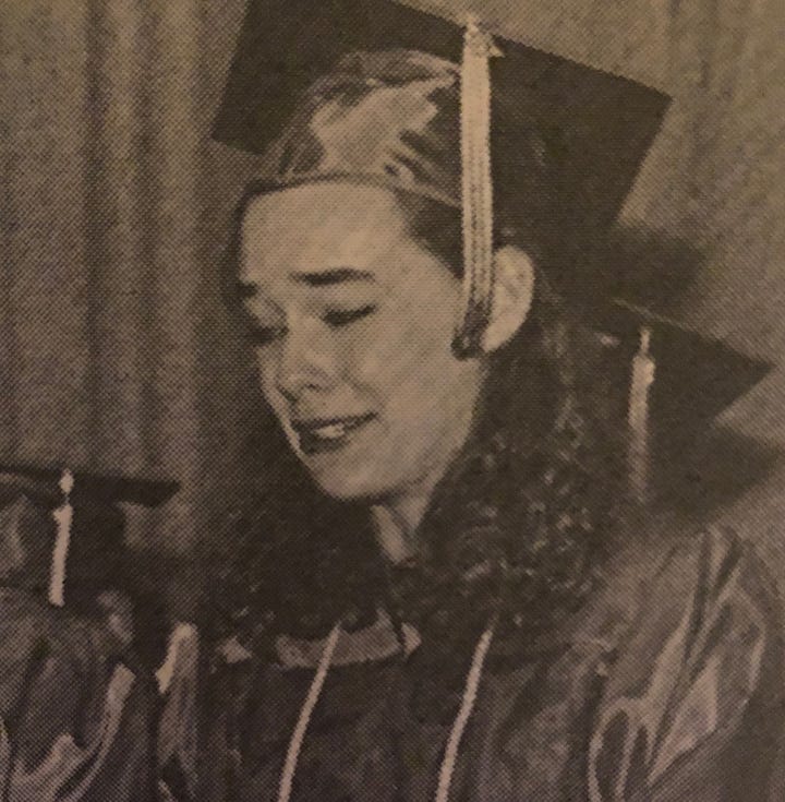 Flashing "tah-dah!" in rainbow tie-dye, being a ham with a rose in my mouth, blubbering in my graduation cap and gown, and sitting on my bed with a huge smile.