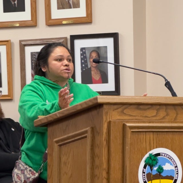 Brianna Whitaker, Britain Vanderbush, Marie and Veno Nathraj speaking in support of the Farmers Market during public comment.
