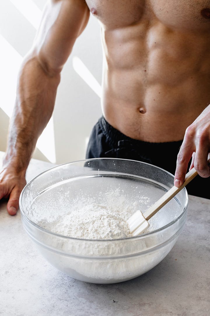 Shirtless man in black pants making vegan American buttercream step by step