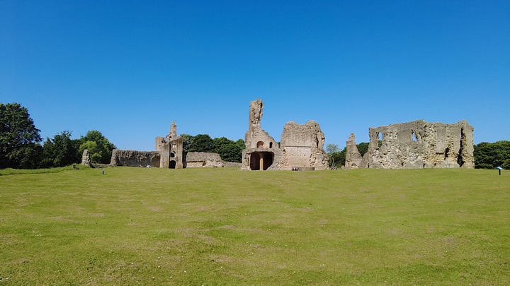 Four photos of the central ruins of Old Sherborne Castle, Dorset. Set against a beautiful, blue and cloudless sky. Part of the Great Tower remains along with walls of the Great Hall and kitchen area.  Images: Roland's Travels