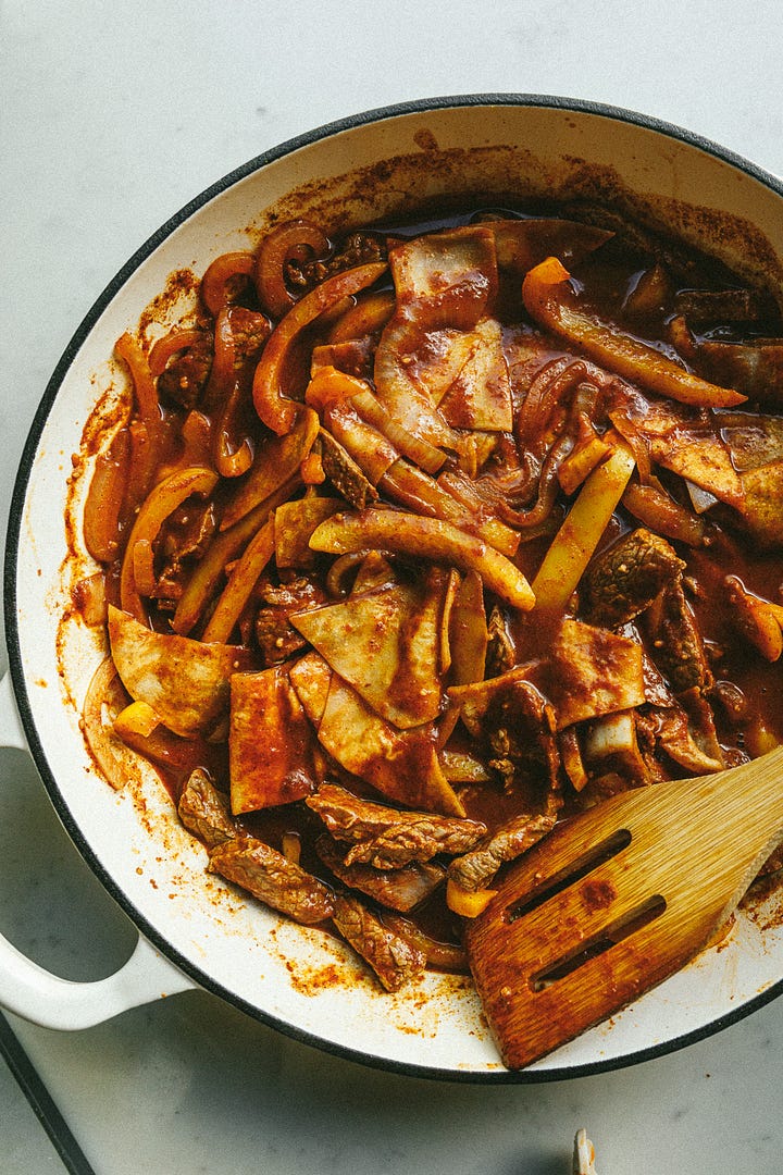 Steak fajita enchilada skillet with avocado salsa and Greek yogurt.