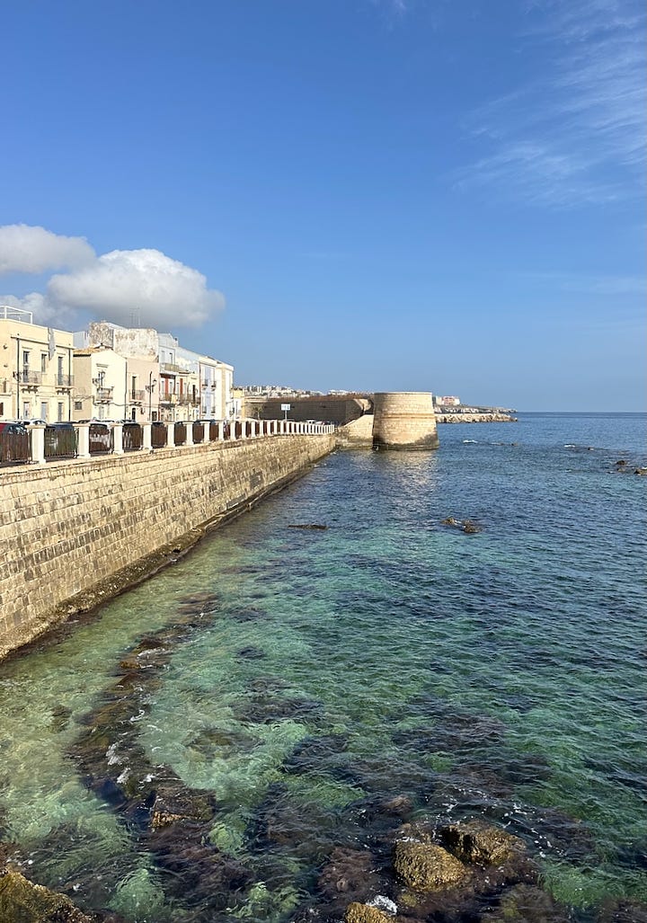 View along the Lungomare towards Forte S.Giovannello+ Ramshackle Palazzo's:Gillian Knows Best guide to Ortigia