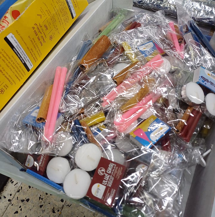 Boxes, table of wrapped food, Sabbath ritual items 