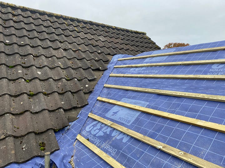 roof felt tucked under the existing roof tiles