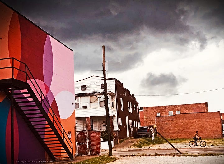 Two photos of bicyclists on the urban streets of West Virginia.