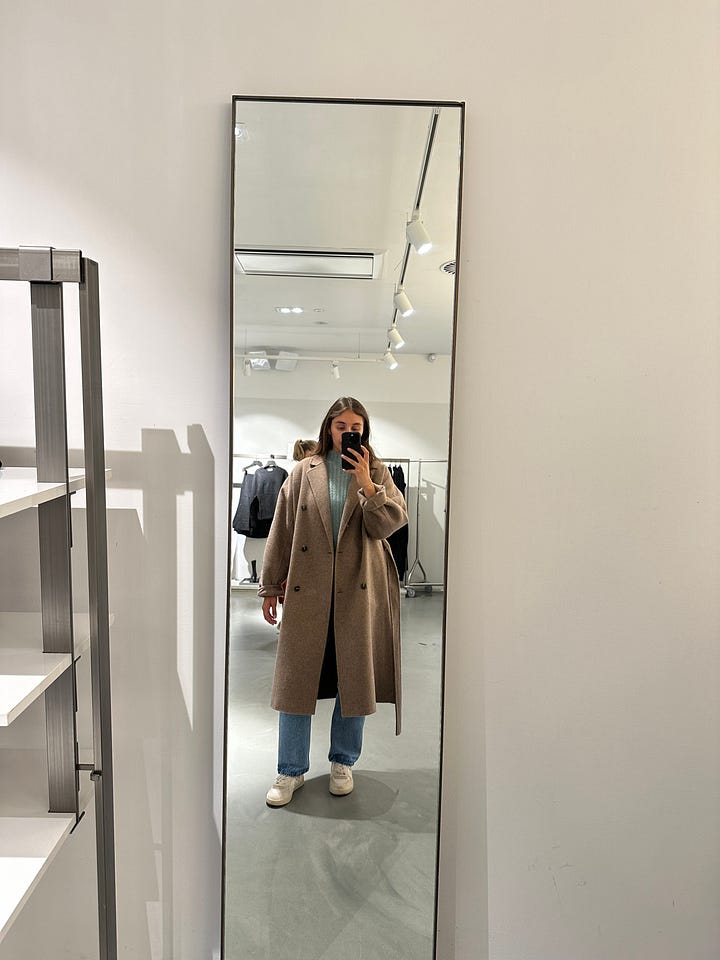 woman taking picture in mirror