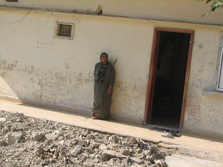 Palestinian residents assess damage after Israeli strike in Ain-al Hilweh shortly before ceasefire