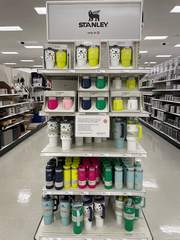 One image with a display of Stanley Cups at Target, the other image with a zoomed in photo of a sign limiting customers to 5 per purchase.