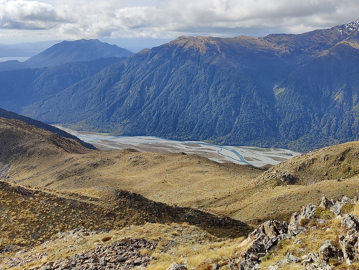 Carroll Hut, Hokitika driftwood sign, Taramakau River valley and the Heaphy Track at coast level