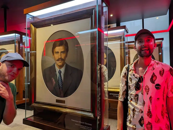 A church in São Paulo, one traveler smiling next to a man's portrait, two travelers waiting for the subway, and all three travelers smiling in a bar and toasting beers