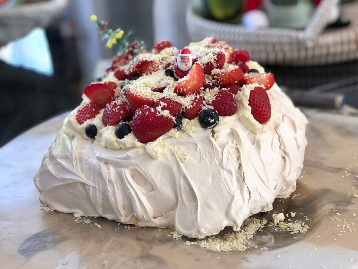 A beautiful pavlova and a spread of meat and veg