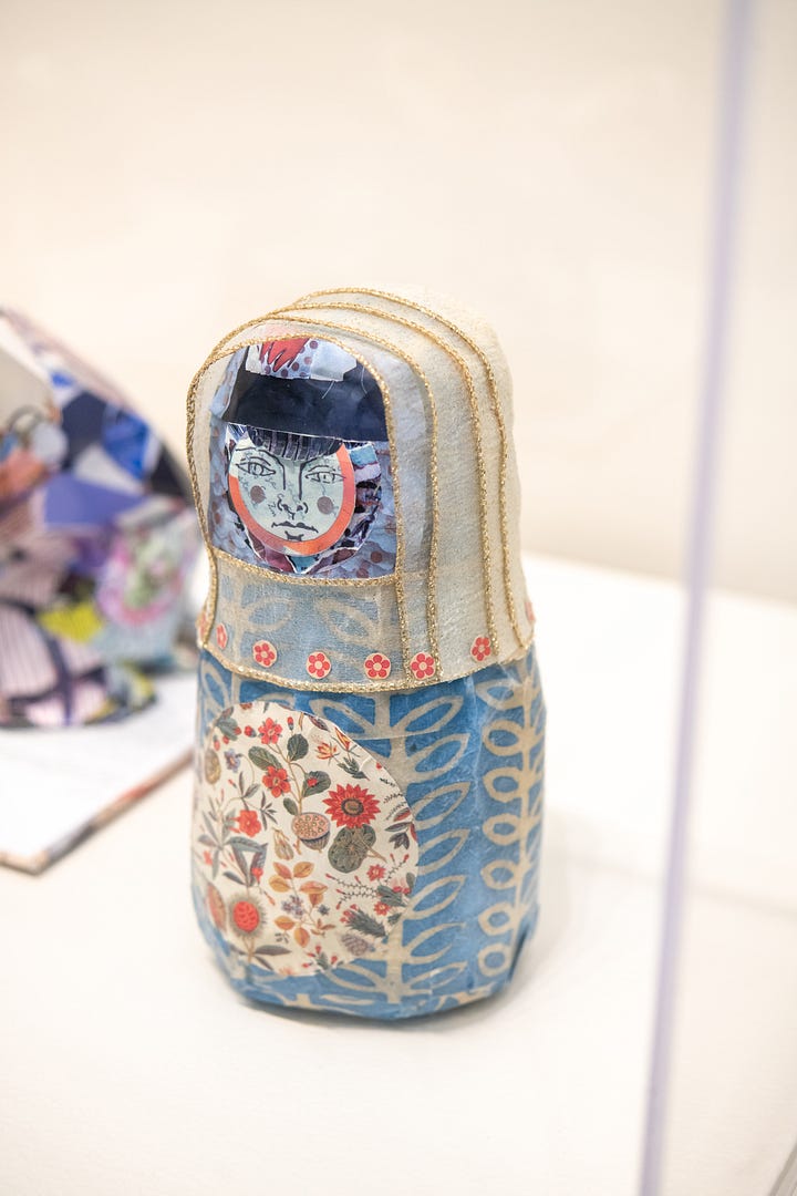 The first image depicts 3D sculptural collage of a blue matryoshka doll; the second image depicts a digitally composed collage including several trilobite species and a blue grid pattern as a background