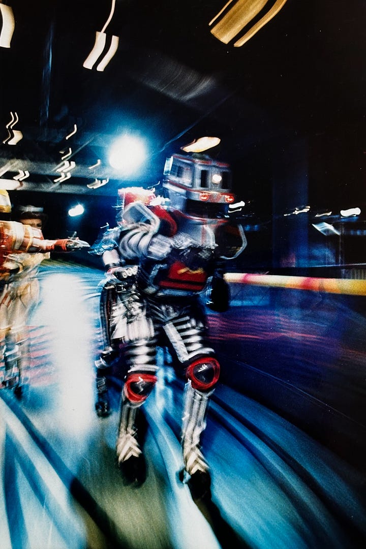 Blurred color photos Starlight Express cast members in costume 