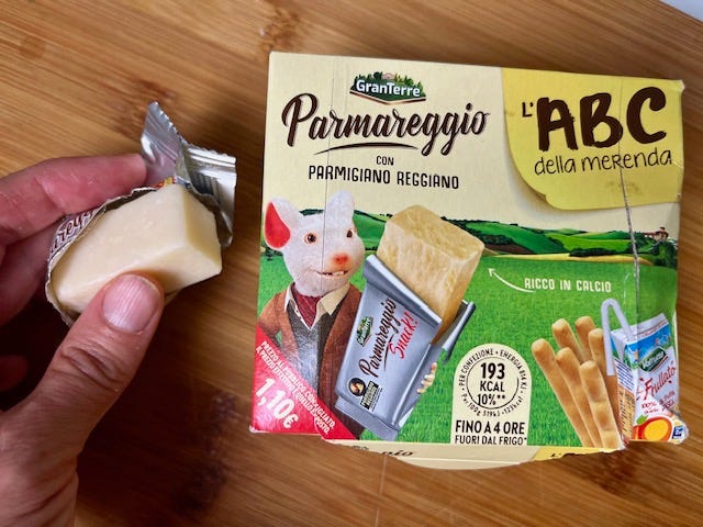 left to right: foil-wrapped bocconcino of parmigiano reggiano and a Parmareggio snack box, chunks of parmigiano at home on a wooden cutting board with a wooden handled cheese knife