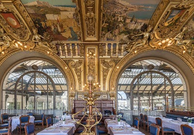 Paris train station entrantrance at Gare de Lyon, a glass and steel girder roof, and hihgoy ornanate images of the decoration in the restaurant.