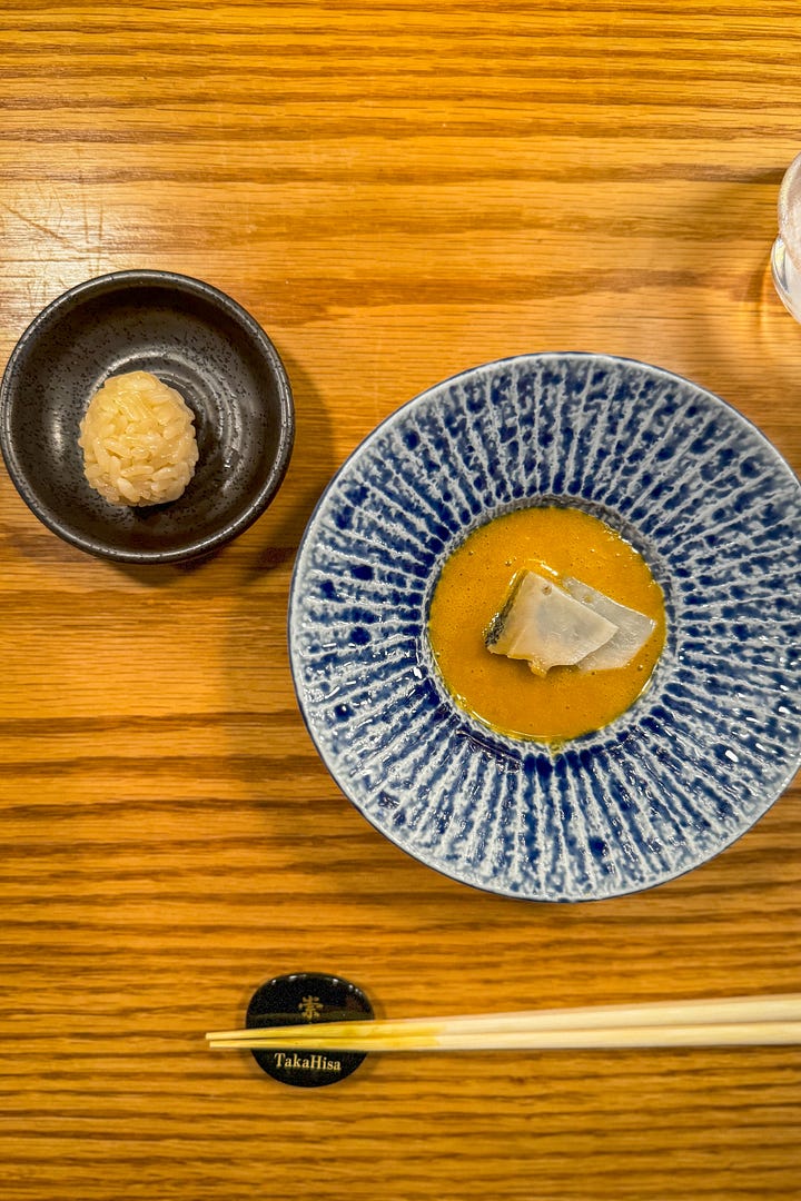 Chef Taka showing off his long-developed steamed abalone in liver sauce