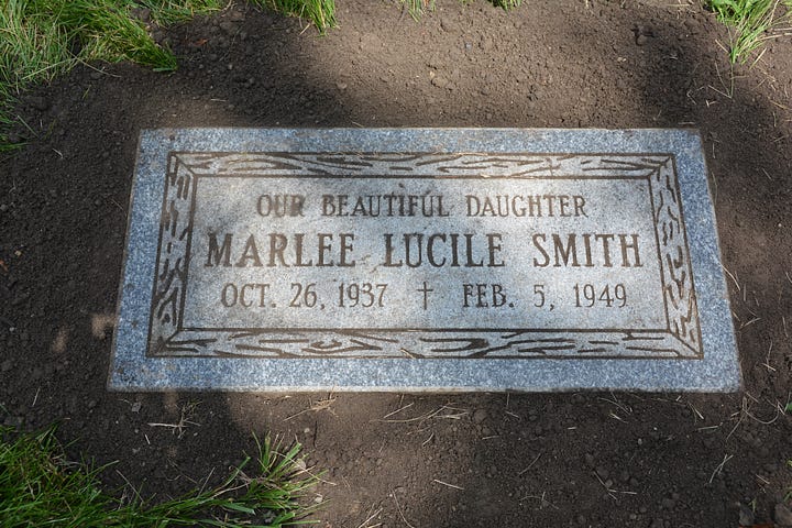 Two headstones: one for Marlee Lucile Smith and one for Robert Smith