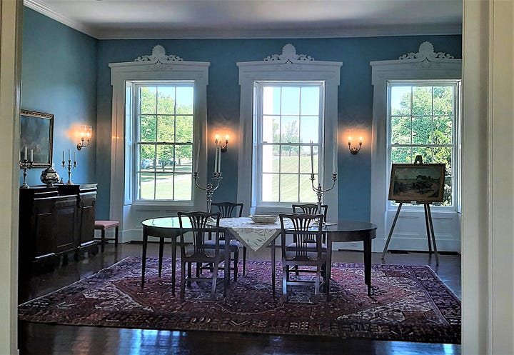 Inside Longwood Plantation house, showing the dining room and stairway.