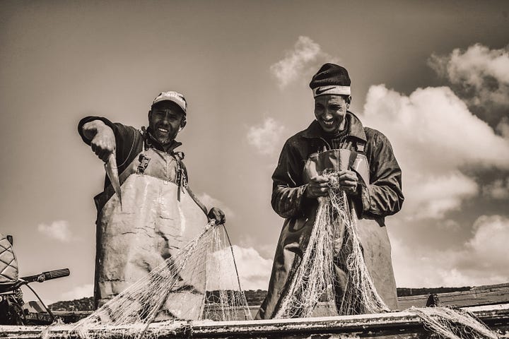 Two different perspectives of fishermen providing for their families in black and white