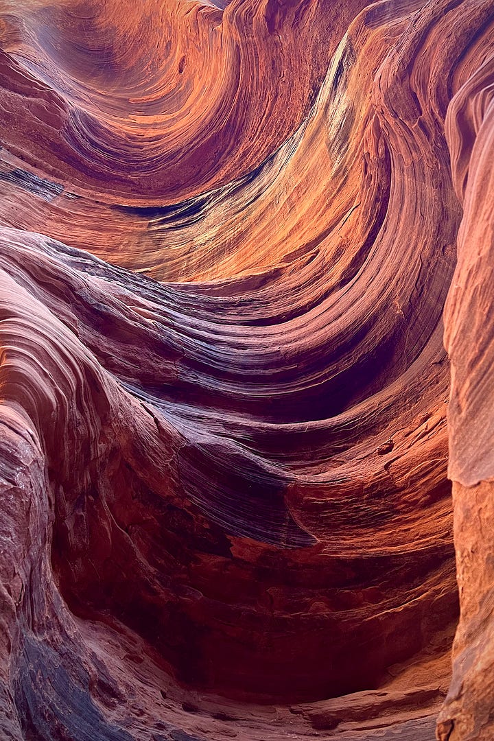 Hiking through a slot canyon in Kanaub, Utah.