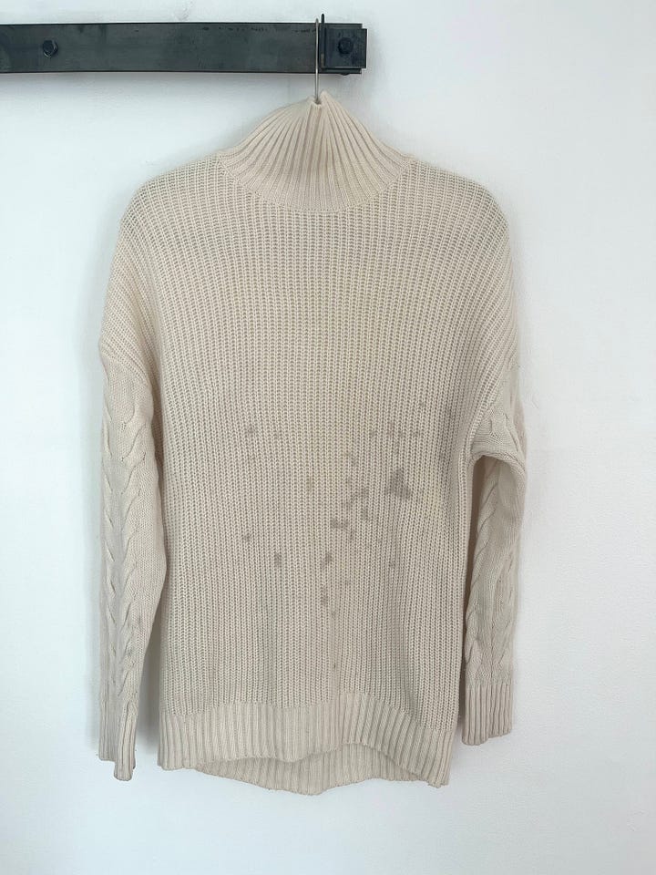 1 stained sweater + 1 damaged sweater