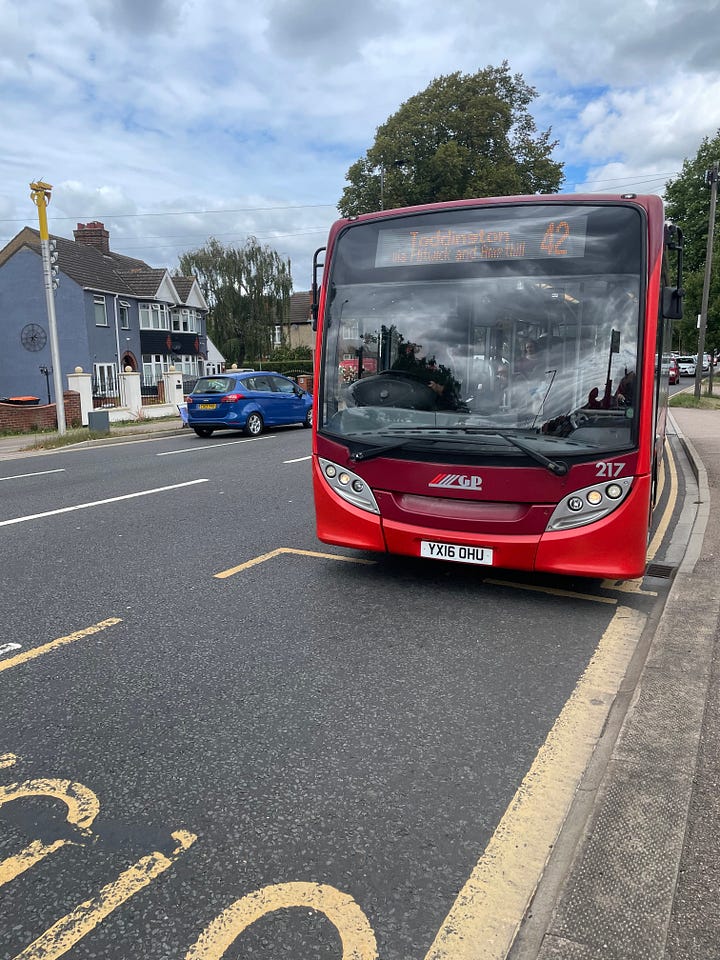 Two of the images show buses, one is blue with white stripes and the other is red. Two pictures show people sat on each bus