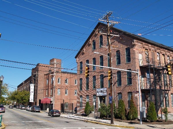 Central Falls police station at left; historic mill buildings at right