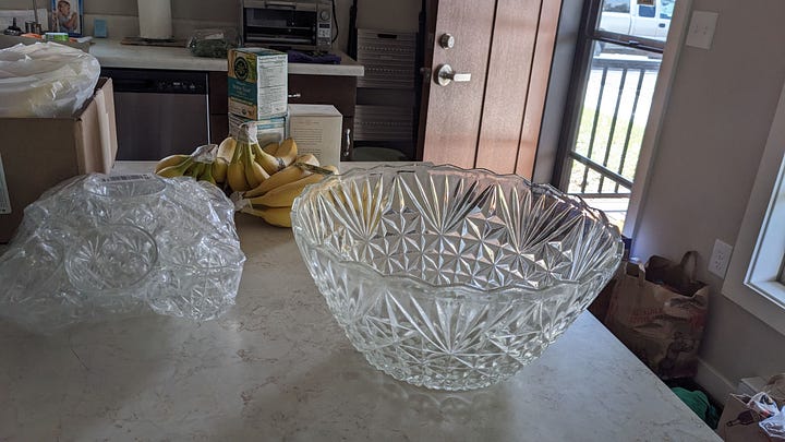 an image gallery of green chiles, fresh curry leaves, japanese citrus chili paste, grocery goodies taking up the floor, and a thrifted punch bowl and cups
