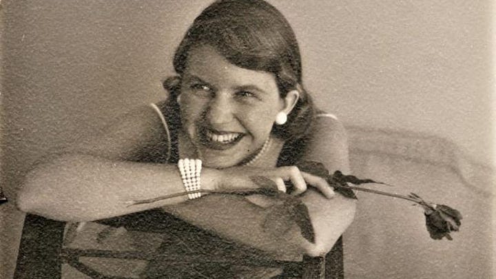 Left" Woman with medium-brown hair wearing white earrings holds a flower.  A white braclet is around her wrist and she wears a spaghetti-strap dress.  Right: A woman with black hair sits in front of a brick and wood background. her hair cascades past her shoulders. She wars a black, sleeveless blouse..