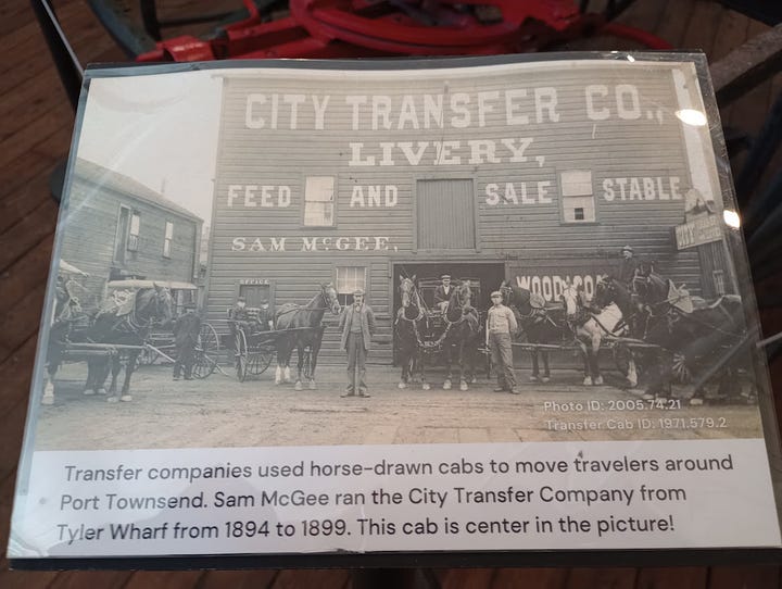 Horse=drawn four-wheel cab, photo of large wooden building with people and horses