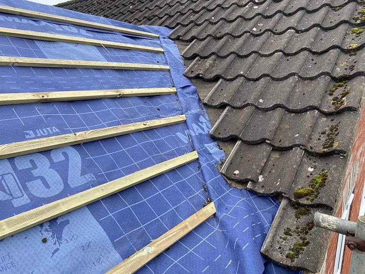 roof felt tucked under the existing roof tiles