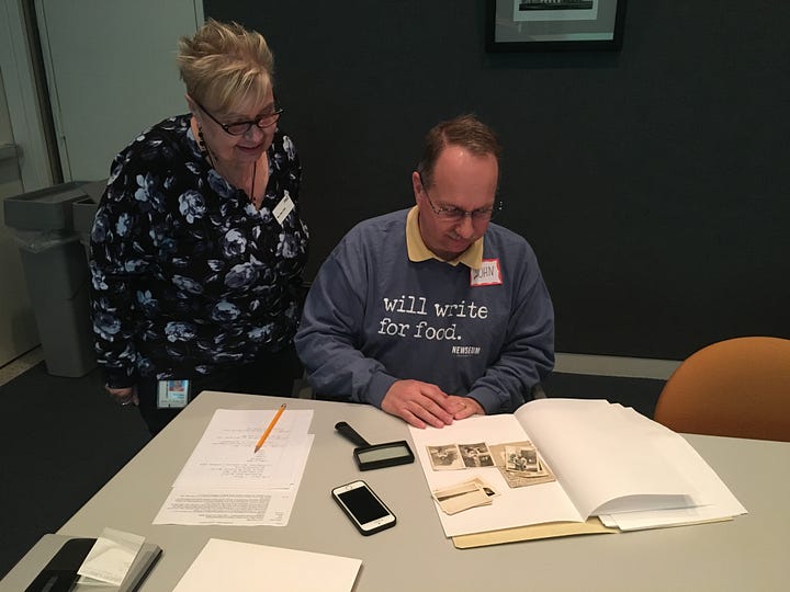 four photos of people looking at old photos, brochures, scrapbooks, postcards, and other artifacts, including with magnifying glasses.