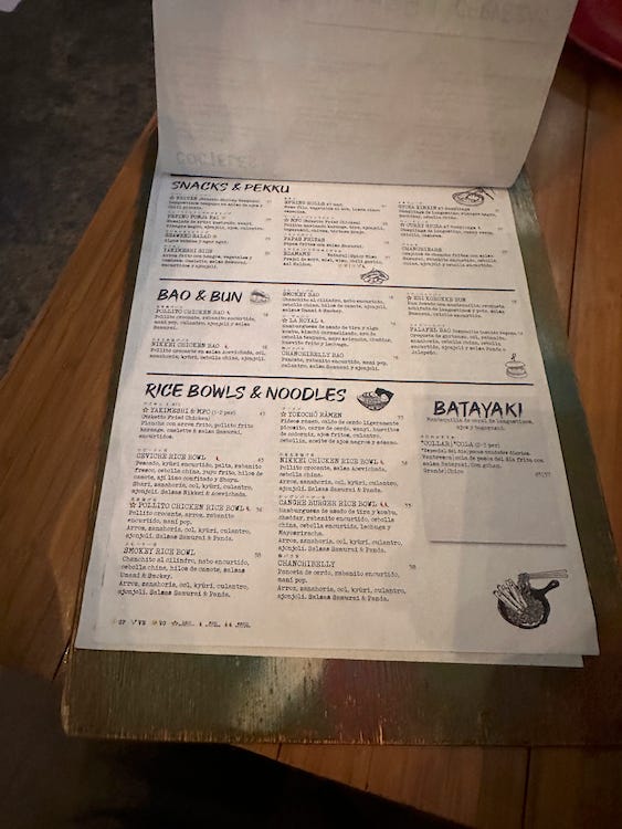 Sutorīto Māketto's menu comes in a clipboard. The focuses are sushi, snacks, and rice bowls and noodles