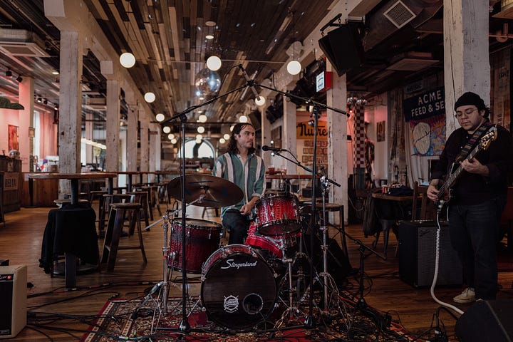 Five stills from Griffin Moyer's performance at Acme Radio Live in the main bair area of Acme Feed & Seed. Some members of the band are also featured.