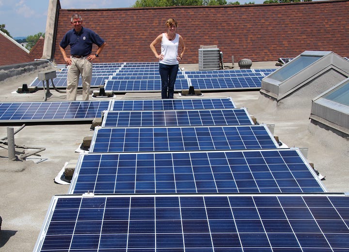 Pictured on left, Don Sommerfield and his student assistant, Courtney Brown, survey the second installation of solar panels on the rooftop of First Presbyterian Church, Jeffersonville, Indiana. Pictured on right is an ad for Interfaith Power and Light's annual challenge for congregations to become "sustainable leaders in their communities." 